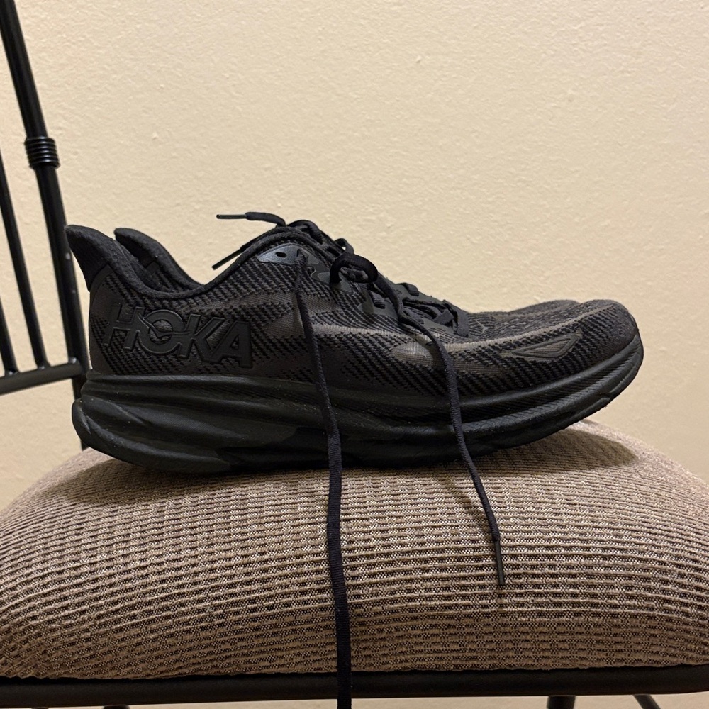 All black Hoka Clifton 9 shoes